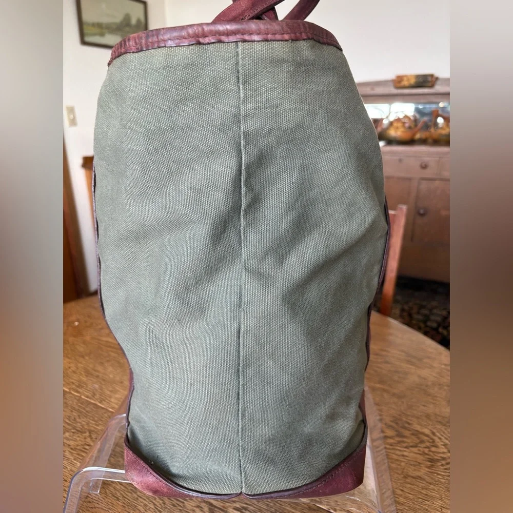 Vintage Eddie Bauer, green canvas w/leather trim handles/bottom top snap closure
